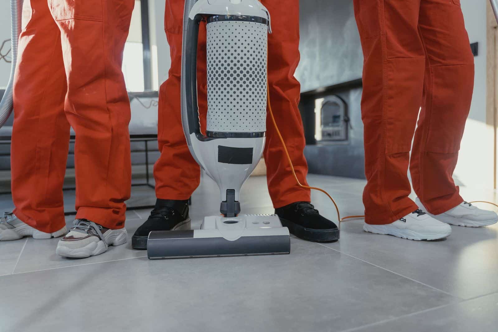 Team of professional commercial cleaners with equipment